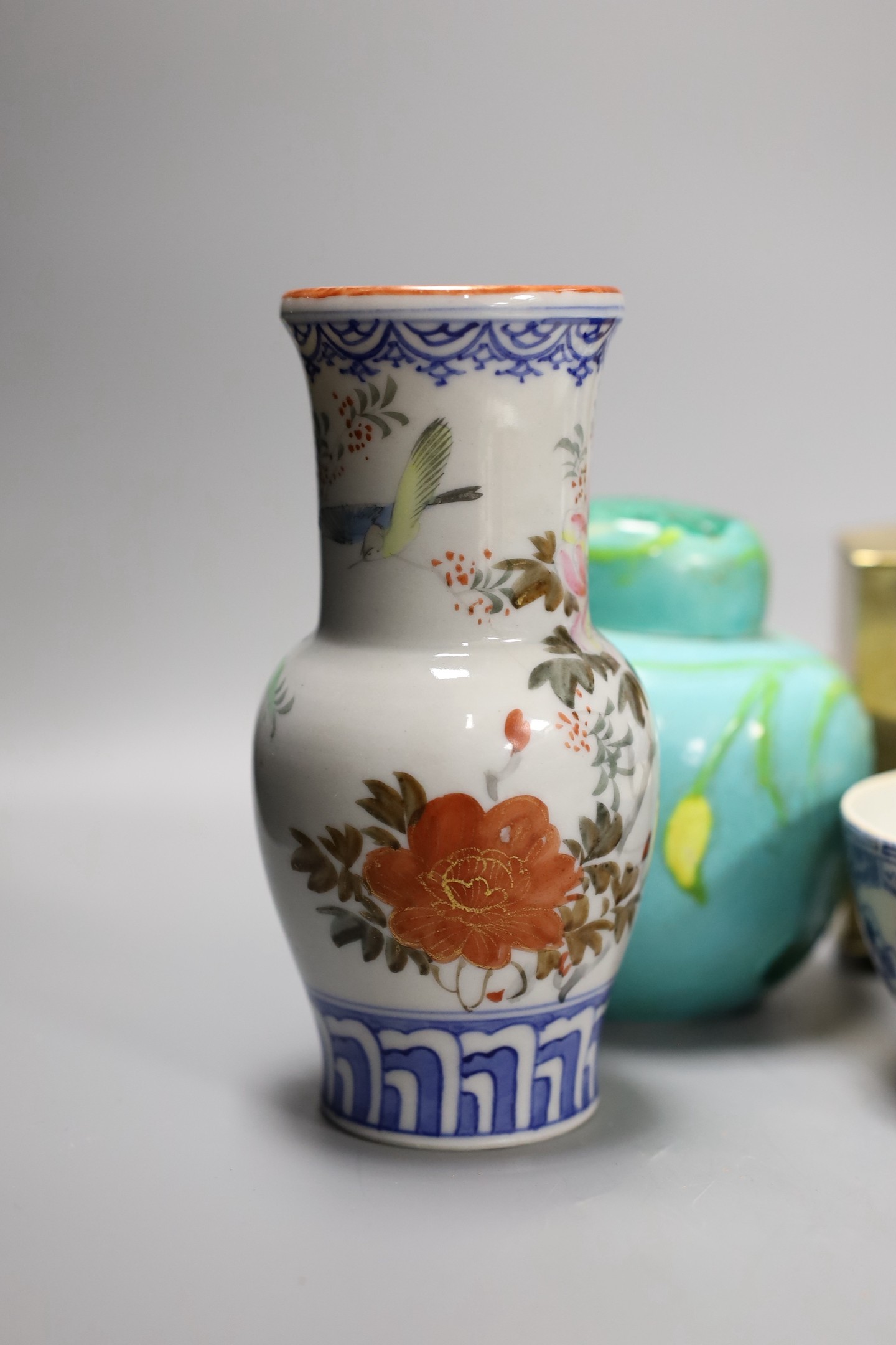 A Chinese brass tea caddy and kettle together with three similar blue and white porcelain bowls, three jars and covers and a Japanese vase